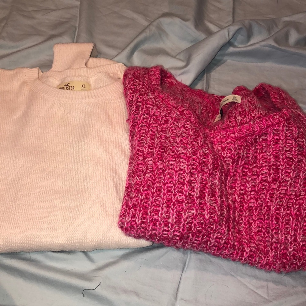 2 pink sweaters